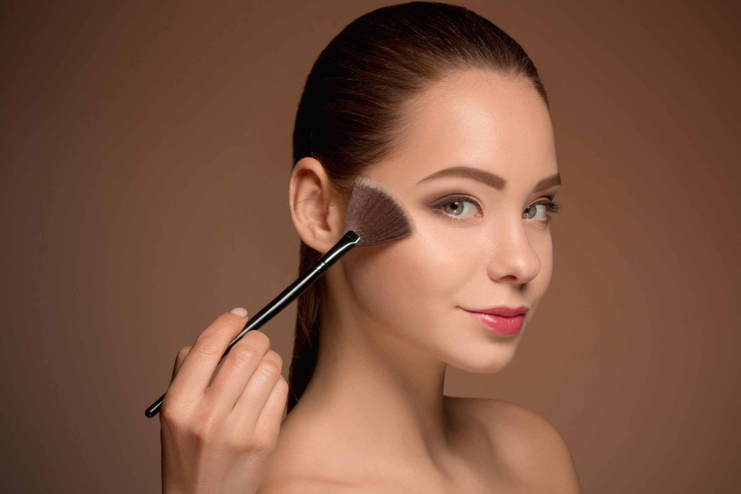 beauty girl with makeup brush perfect skin applying makeup scaled